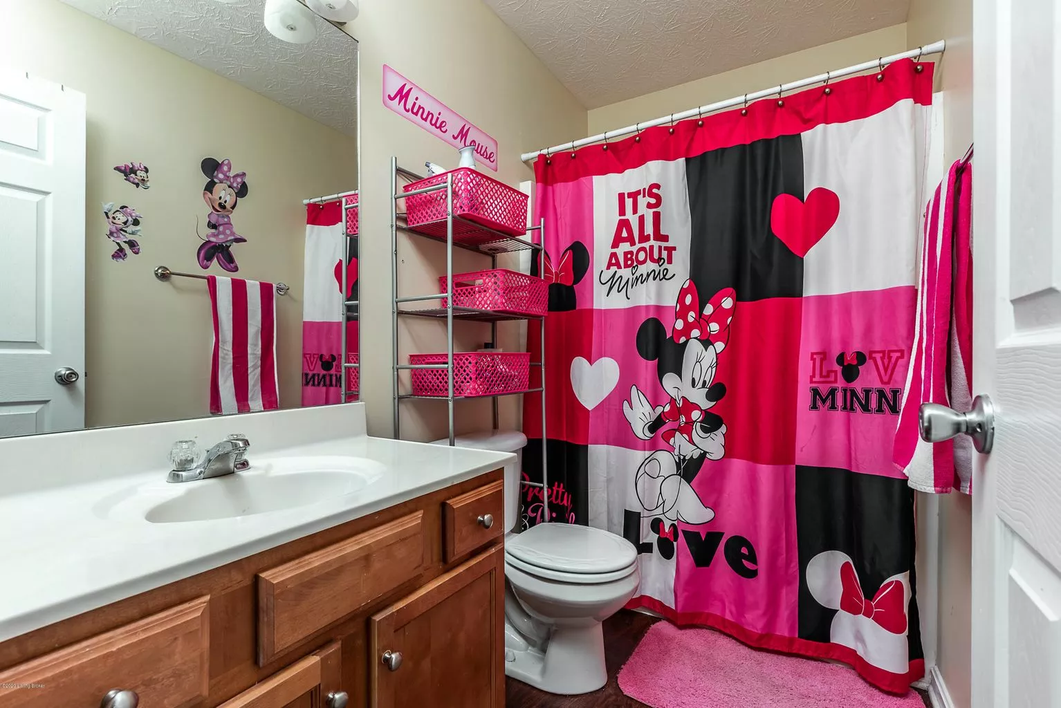 Bathroom listing photo with poor lighting and poor storage space