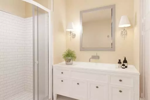 Bathroom after a virtual renovation, modern white cabinet and modern shower tile