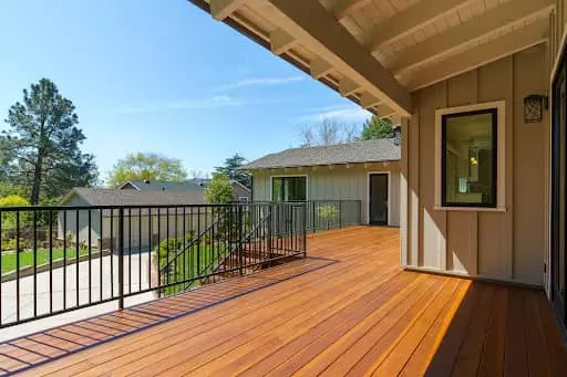 Home exterior, empty deck for no curb appeal, before virtual staging